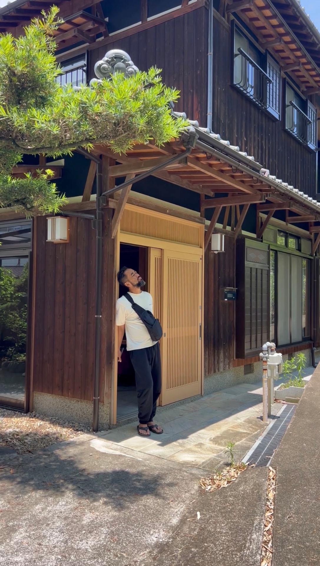 Host at the entrance of the traditional kominka in Myodani, Kobe